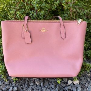 Pink Coach very clean condition.. Gently used like twice